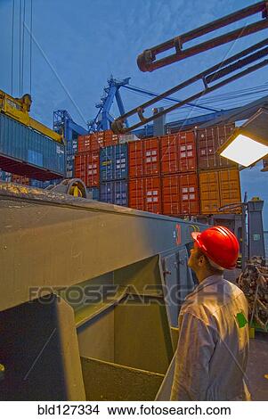 seaman watching container being loaded View Large Photo Image Picture - seaman watching container being loaded. Fotosearch
