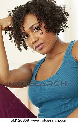 Stock Photo - Serious mixed race woman. Fotosearch