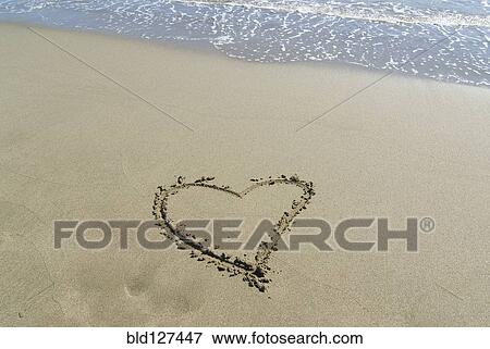 Spain Andalusia heart shape drawn in sand on beach View Large Photo Image Stock Photo - Spain Andalusia heart shape drawn in sand on beach. Fotosearch