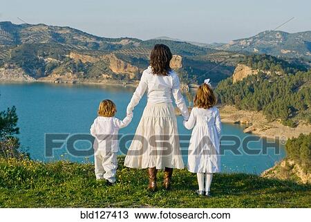 Spain Malaga mother and children looking at lake rear view View Large Photo Image Stock Image - Spain Malaga mother and children looking at lake rear view. Fotosearch