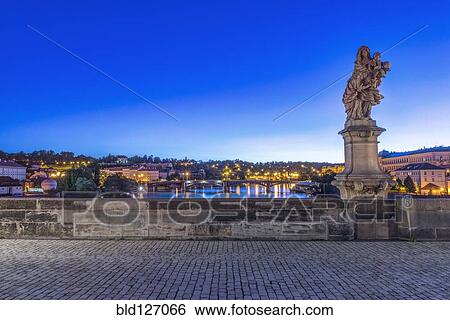 Statue and cobblestones on Charles Bridge at dawn, Prague, Czech Republic View Large Photo Image Stock Photograph - Statue and cobblestones on Charles Bridge at dawn, Prague, Czech Republic. Fotosearch