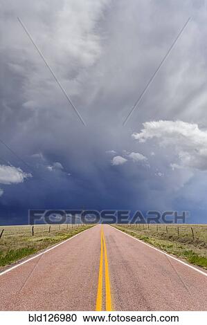 Storm clouds over open road, Rush, Colorado, United States View Large Photo Image Stock Image - Storm clouds over open road, Rush, Colorado, United States. Fotosearch