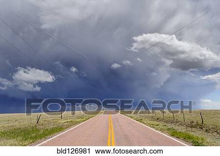 Storm clouds over open road, Rush, Colorado, United States View Large Photo Image Stock Image - Storm clouds over open road, Rush, Colorado, United States. Fotosearch