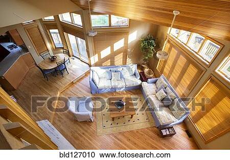 Stock Image - View of living room and dining room from loft. Fotosearch