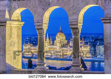 Picture - View of Parliament Building illuminated at dusk, Budapest, Hungary. Fotosearch