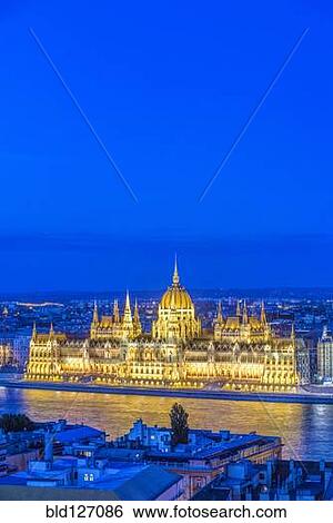 View of Parliament Building illuminated at dusk, Budapest, Hungary View Large Photo Image Stock Photograph - View of Parliament Building illuminated at dusk, Budapest, Hungary. Fotosearch