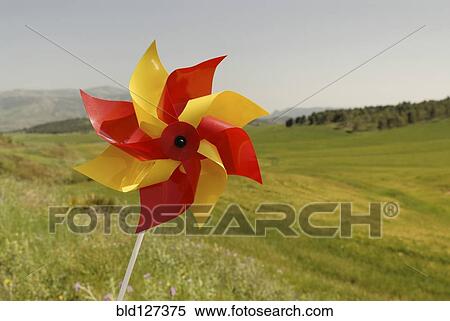 Stock Photography - Windwheel on green rolling hills. Fotosearch