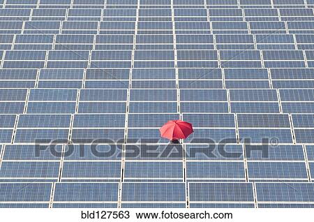 woman holding red umbrella in solar plant View Large Photo Image Stock Image - woman holding red umbrella in solar plant. Fotosearch