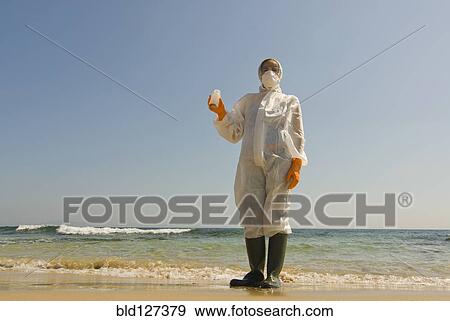 Woman in full-body protective clothing on beach View Large Photo Image Stock Photo - Woman in full-body protective clothing on beach. Fotosearch