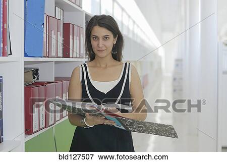Woman with file portrait View Large Photo Image Stock Photo - Woman with file portrait. Fotosearch