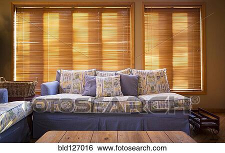 Wood blinds behind sofa in living room View Large Photo Image Stock Photograph - Wood blinds behind sofa in living room. Fotosearch