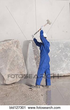 worker attacking marble block with sledgehammer View Large Photo Image Stock Image - worker attacking marble block with sledgehammer. Fotosearch