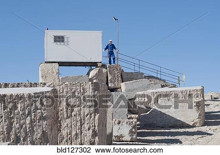 worker standing in front of office container View Large Photo Image Stock Image - worker standing in front of office container. Fotosearch