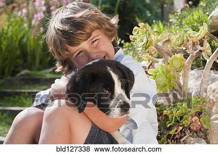 young boy with dog in garden View Large Photo Image Stock Photo - young boy with dog in garden. Fotosearch
