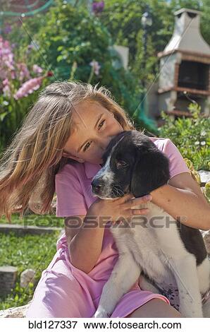 young girl with dog in garden View Large Photo Image Stock Photo - young girl with dog in garden. Fotosearch
