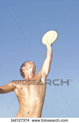 young man catching frisbee View Large Photo Image Picture - young man catching frisbee. Fotosearch