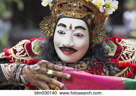 Stock Image - Balinese performer wearing mask and costume, Mas, Bali, Indonesia. Fotosearch