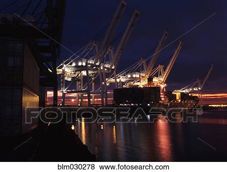 Illuminated cranes over commercial dock at night, Long Beach, California, United States View Large Photo Image Stock Photo - Illuminated cranes over commercial dock at night, Long Beach, California, United States. Fotosearch