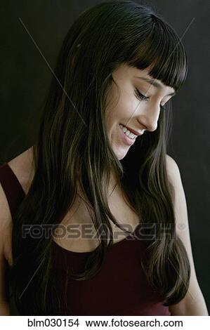 Picture - Mixed race woman smiling. Fotosearch
