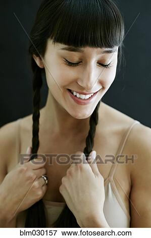 Stock Photo - Mixed race woman smiling. Fotosearch