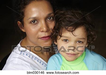 Stock Photograph - Mother holding son. Fotosearch