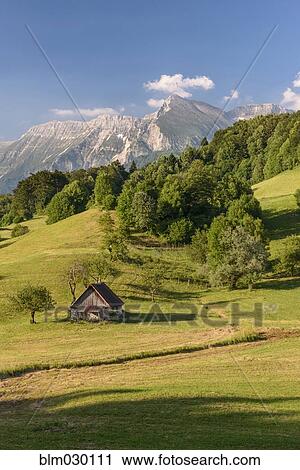 Rocky mountains overlooking rural landscape View Large Photo Image Stock Image - Rocky mountains overlooking rural landscape. Fotosearch