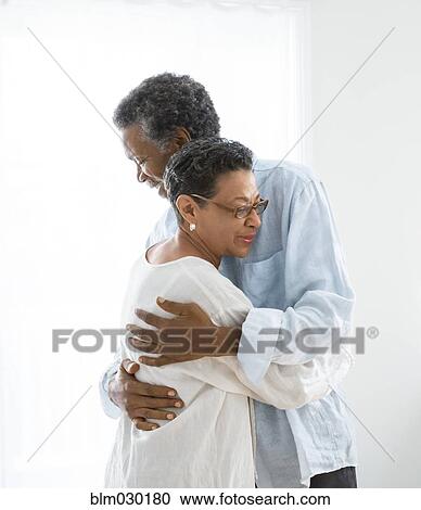 Senior couple hugging indoors View Large Photo Image Stock Image - Senior couple hugging indoors. Fotosearch