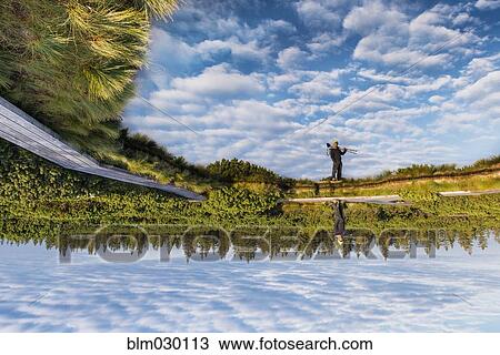 Sky and rural landscape reflected in still lake, Pohorje, Stajerska, Slovenia View Large Photo Image Stock Image - Sky and rural landscape reflected in still lake, Pohorje, Stajerska, Slovenia. Fotosearch