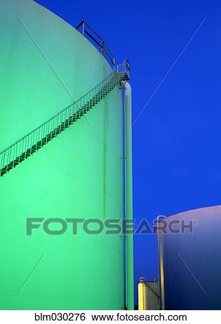 Stock Photograph - Storage tank at twilight. Fotosearch