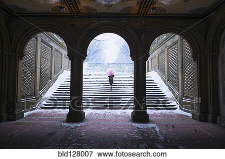 Asian woman walking up steps into snow View Large Photo Image Stock Photo - Asian woman walking up steps into snow. Fotosearch