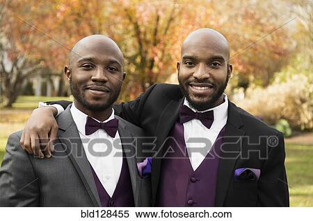 Stock Photography - Black groom and best man posing at wedding. Fotosearch