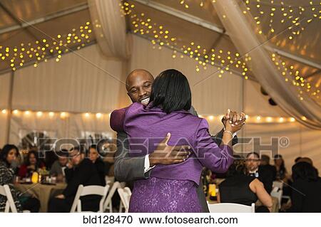 Black groom dancing with mother at reception View Large Photo Image Stock Image - Black groom dancing with mother at reception. Fotosearch