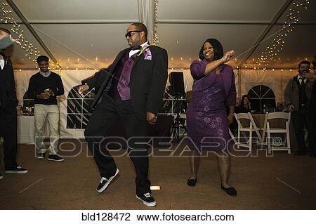 Black groom dancing with mother at reception View Large Photo Image Stock Image - Black groom dancing with mother at reception. Fotosearch