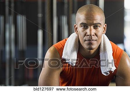 Black man resting in gym View Large Photo Image Stock Photo - Black man resting in gym. Fotosearch