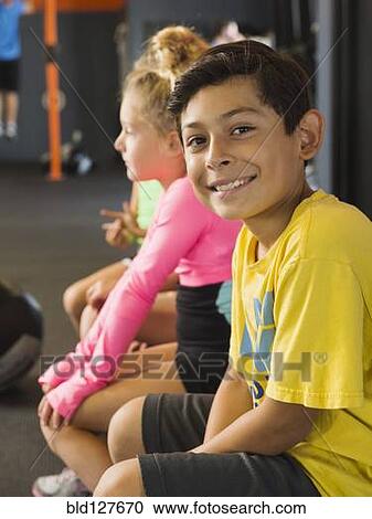 Stock Image - Boy smiling in gym. Fotosearch