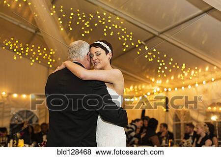 Bride dancing with father at reception View Large Photo Image Stock Photo - Bride dancing with father at reception. Fotosearch
