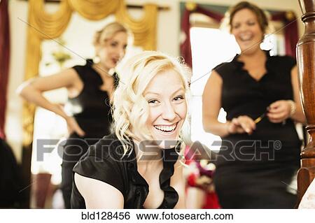 Caucasian bridesmaids smiling together View Large Photo Image Stock Photograph - Caucasian bridesmaids smiling together. Fotosearch