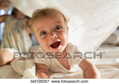 Caucasian children playing under blanket View Large Photo Image Stock Photo - Caucasian children playing under blanket. Fotosearch