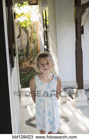 Caucasian girl smiling in foyer View Large Photo Image Stock Image - Caucasian girl smiling in foyer. Fotosearch