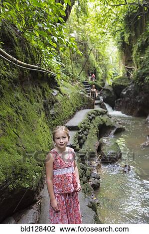 Caucasian girl smiling in tropical rainforest View Large Photo Image Stock Image - Caucasian girl smiling in tropical rainforest. Fotosearch
