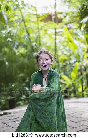 Stock Photo - Caucasian girl wrapped in blanket. Fotosearch
