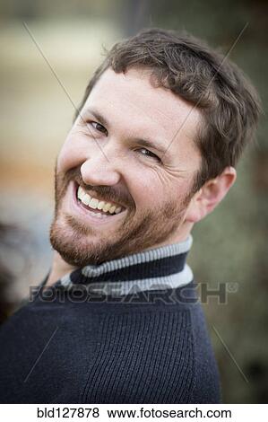Caucasian man laughing outdoors View Large Photo Image Stock Photo - Caucasian man laughing outdoors. Fotosearch
