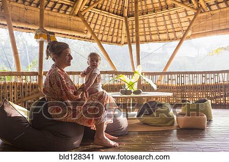 Caucasian mother bouncing baby on knee View Large Photo Image Stock Image - Caucasian mother bouncing baby on knee. Fotosearch