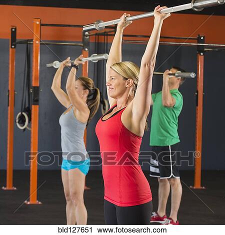 Caucasian people working out in gym View Large Photo Image Stock Image - Caucasian people working out in gym . Fotosearch