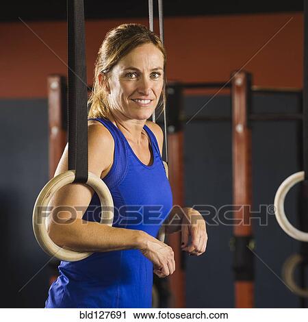 Caucasian woman resting in gym View Large Photo Image Stock Image - Caucasian woman resting in gym. Fotosearch