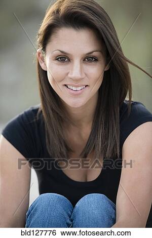 Stock Photograph - Caucasian woman smiling outdoors. Fotosearch