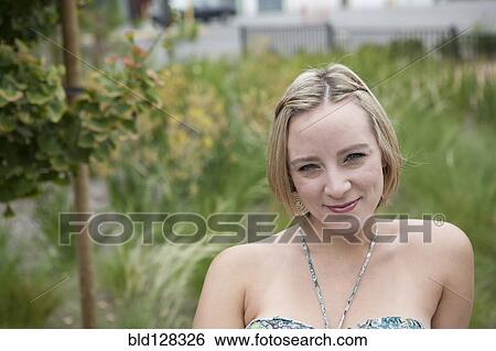 Stock Photograph - Caucasian woman smiling outdoors. Fotosearch