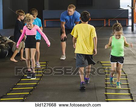 Stock Photo - Children training in gym. Fotosearch