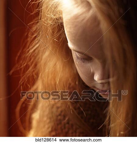 Picture - Close up of Caucasian girl looking down. Fotosearch