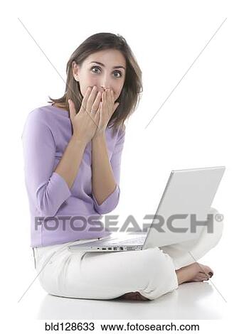 Gasping woman using laptop View Large Photo Image Stock Image - Gasping woman using laptop. Fotosearch
